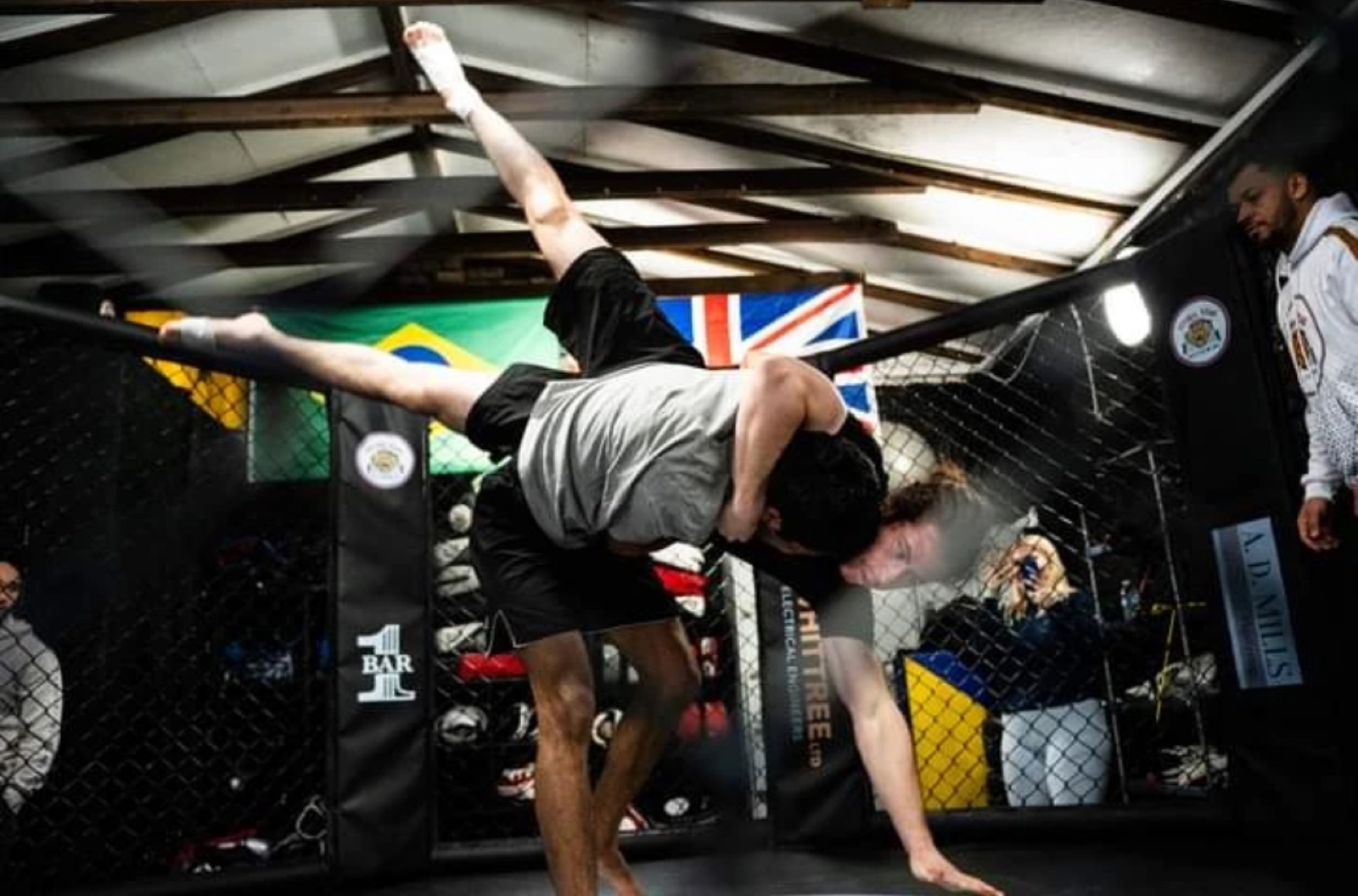 Grappling takedown in the Union Thai cage