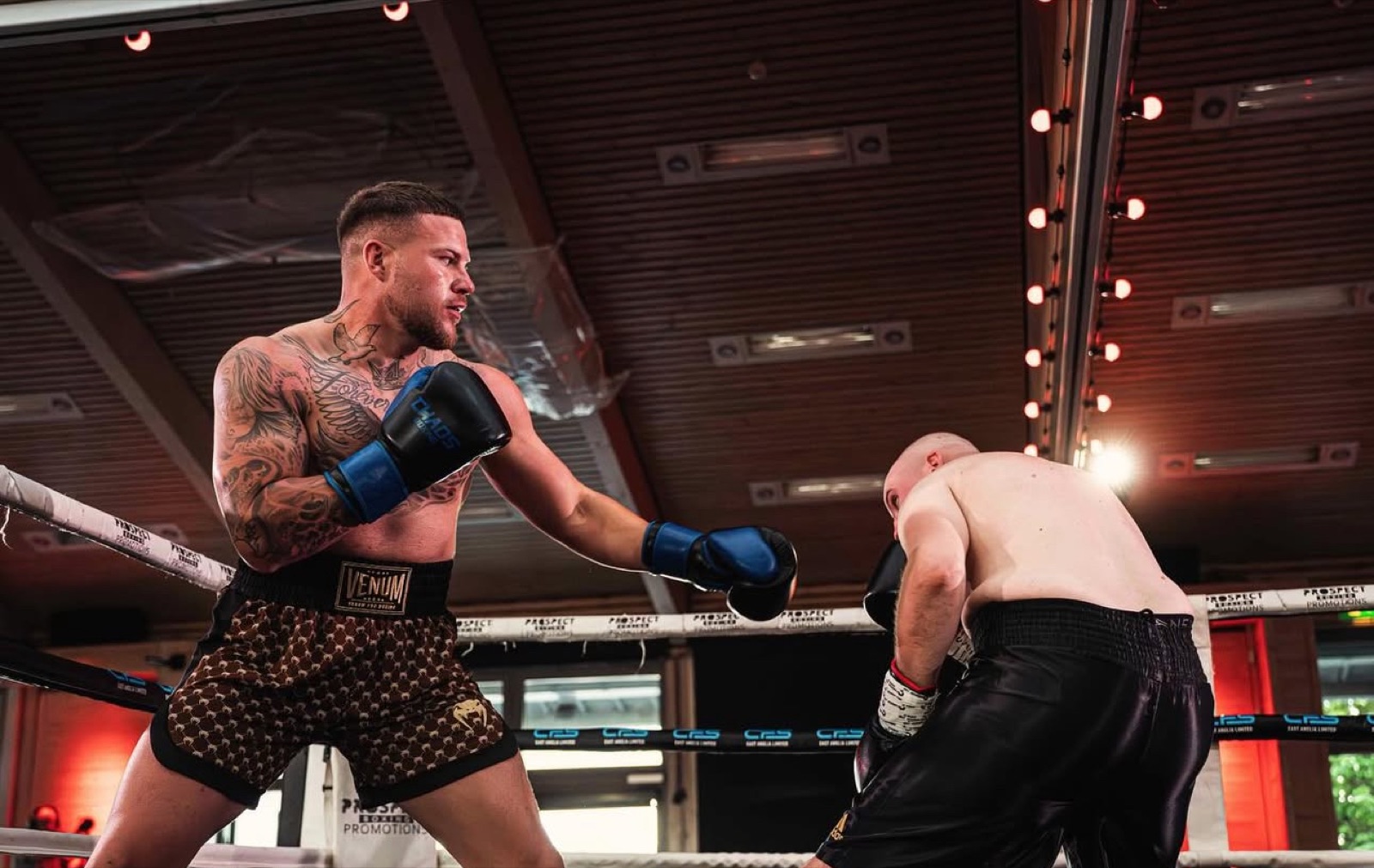 Tattooed Union Thai fighter working in the ring